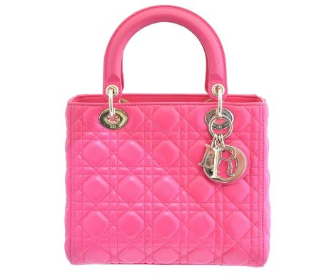 A Christian Dior Lady Dior MM bag, circa 2014, the quilted fuschia pink cannage leather with double top handles and an option