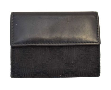A Gucci Flap Coin Case Wallet, the black maker's monogrammed canvas exterior with ruthenium hardware and smooth black leather