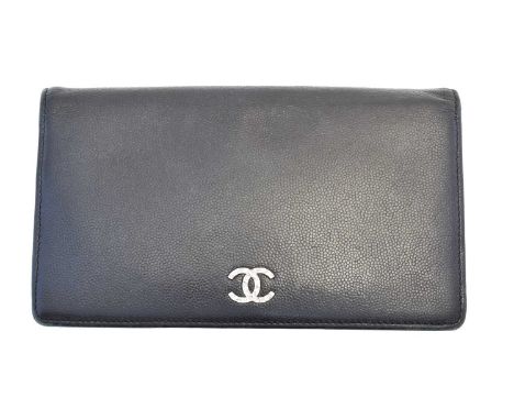 A Chanel Logo Bifold Long Wallet, circa 2009-10, the black caviar leather exterior with textured silver-tone hardware, serial