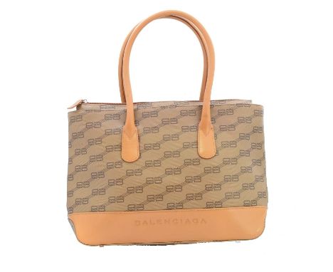 A Balenciaga bag, the maker's monogram coated canvas with smooth tan leather accents, silver-tone hardware and twin rolled ha