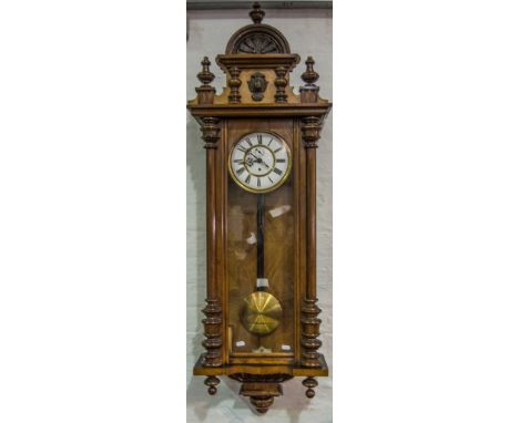 Walnut cased Vienna wall clock, architectural pediment, enamel dial, spring driven movement, 140cm.