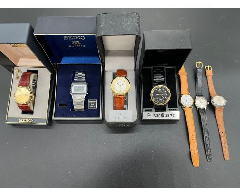 RYTIMA -  A gilt cased wristwatchSweep second hand, manualSEIKO - A gentleman's gilt cased wristwatch Gilt dial with day date