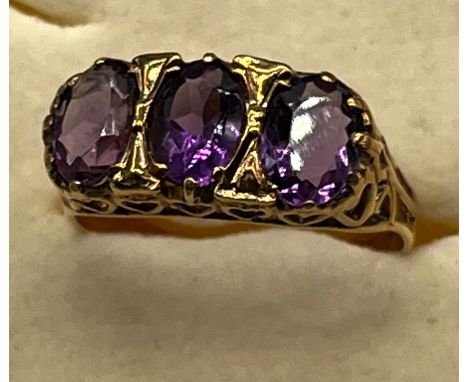 Ladies 9ct yellow gold and three Amethyst stone ring. [Ring size P] [2.89Grams] 