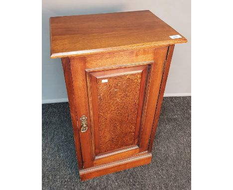 Arts and crafts oak side cabinet, the rectangular top above a panel door leading to interior shelving, raised on plinth base 