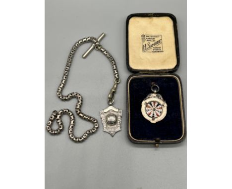 A Chester silver football fob medal with a plated albert chain. Together with a Birmingham silver and enamel darts fob medal,