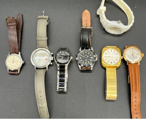 Seven various wrist watches: GARRARD - A gentleman's gilt cased wristwatch, Gilt dial sweep second hand, leather strap, manua