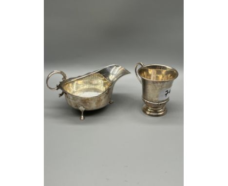 A Birmingham silver Celtic band design coffee can, Together with a Birmingham silver gravy boat. [162grams]“Formerly at Lette