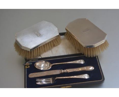 An Edwardian Birmingham silver three piece Christening set comprising a fork, spoon and knife and a pair of Birmingham silver