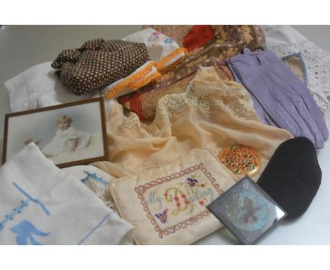 A 1920s lace trimmed peach satinised camisole top, a pair of Dents gloves, size 7 1/2 in lavender, a patchwork cushion style 