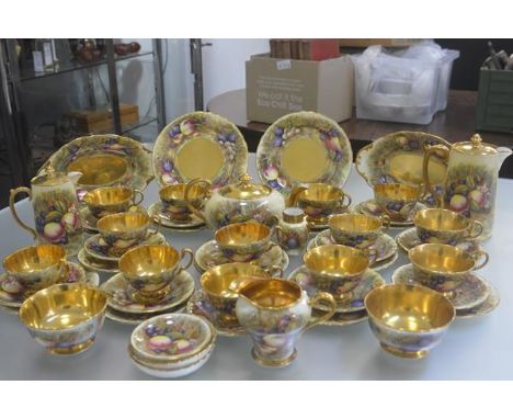 An Aynsley china gilded fifty two piece tea and coffee service with transfer printed fruit, complete with coffee pot, teapot,