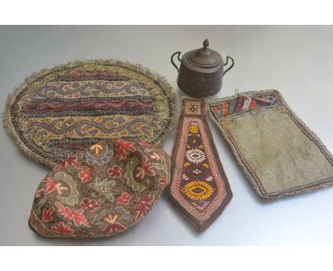 An Eastern brass two handled sugar basin and cover and a collection of embroidered 19thc and later Nomadic Iranian panels inc