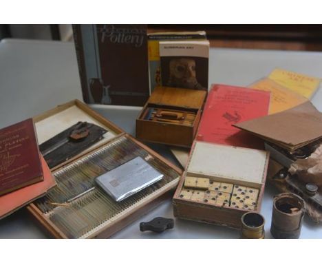 A mixed lot containing a treen carved box with pencils, a white metal cigarette case, a box with bone dominoes, a pocket micr