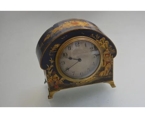A 1920s French mantel clock with chinoiserie blue ground decorated arched case, with silvered dial with engine turned decorat
