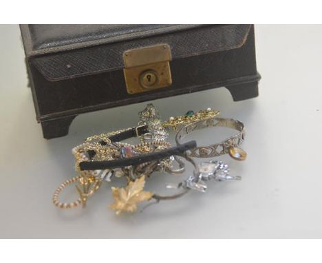 A Birmingham silver stiff hinged bangle with Celtic style knots and lion passant, a lady's quartz wristwatch, a marcasite bro