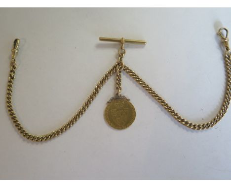A good 18ct gold double Albert watch chain with close curb links, T-bar dog clip and sliding link to a full guinea fob, Georg
