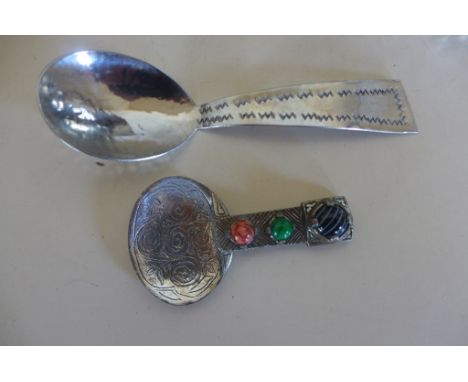 Two Arts and Crafts caddy spoons, one is marked Keswick, in generally good condition 