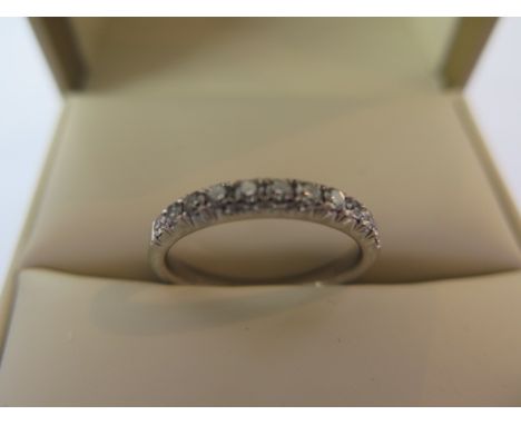 A good quality platinum and diamond half eternity ring, set with eleven brilliant cut diamonds, 0.03ct each approx - total ca