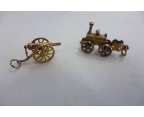 Two 9ct gold charms, a canon and a steam engine, weight approx 3.4 grams 