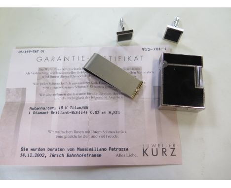 A titanium money clip set with a small diamond 0.03ct colour H SI1, approx 9 grams, a Dupont gas lighter and matching cufflin
