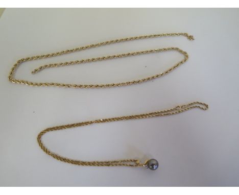 A 14ct gold chain, with an 18ct pearl pendant, total approx 5.3 grams, a 9ct chain with broken link, approx 4.8 grams 