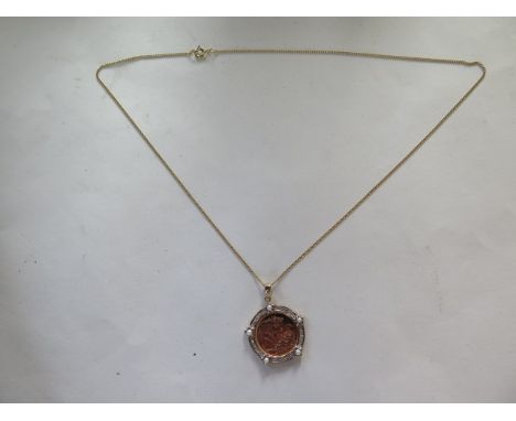 A 2007 gold half sovereign in a 9ct pearl and diamond flower mount, on a 9ct chain, 8.7 grams, in good condition, limited edi