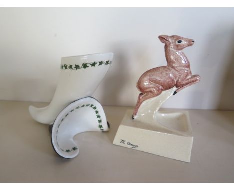 A ceramic figure of a leaping deer, 19cm tall, signed Osmond, overall crazing, but generally good, and a Clarice Cliff Staffo