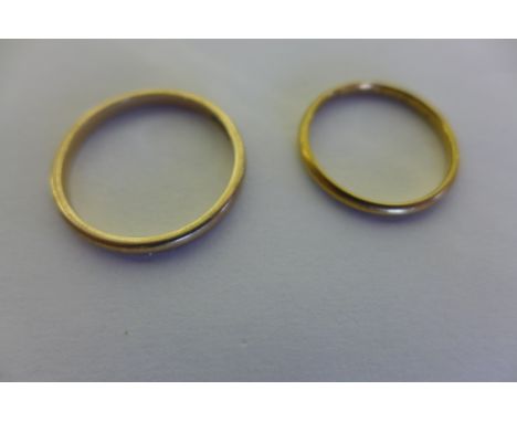 An 18ct yellow gold wedding band, weight approx  1.7 grams, size M, and a 9ct wedding band, weight approx  1.9 grams, size S 