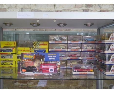 Collection of boxed Diecast vehicles and three fishing rods including  Burago, Maisto, Guiloy.