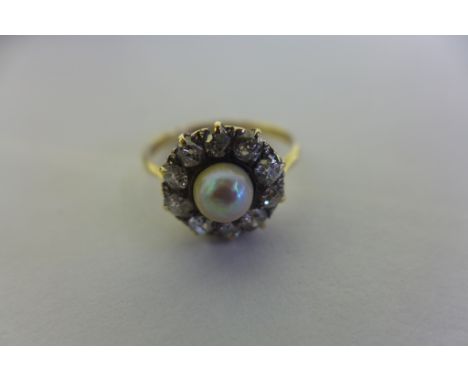 An 18ct pearl and diamond cluster ring, the central pearl diameter 5.5mm, surrounded by ten diamonds of 0.1cts, total 1ct app