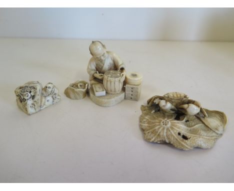 A late 19th century, early 20th century Japanese carved five piece seated figure, a Netsuke and a crab on leaf, 7.5cm wide, s