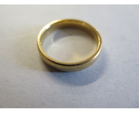 An 18ct gold wedding band, weight 4 grams, size M, clean, light wear 