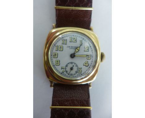 A JW Benson 9ct gold cushion cased wristwatch, white enamel face, with luninous Arabic numerals and hands, subsidiary seconds