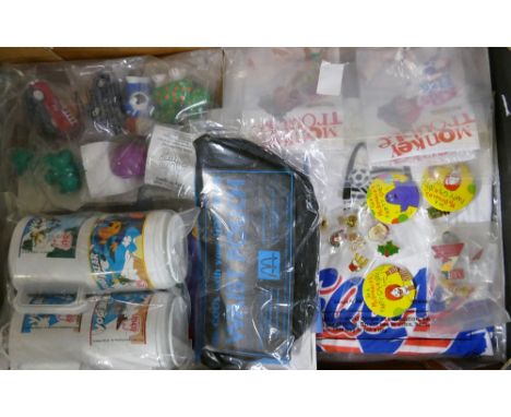 A mixed collection of McDonald adertising items  to include: Badges, cups, T-Shirt etc 