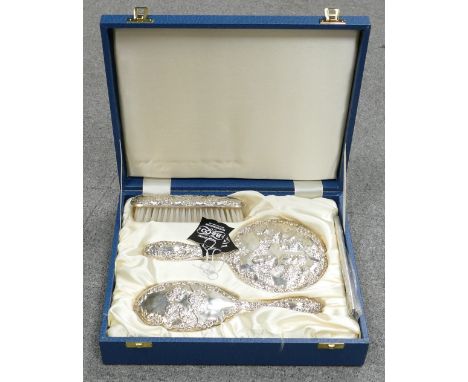 Silver ornate vanity set: comprising Brushes, comb &amp; Mirror set, hallmarked for Birmingham 1988 by B&amp; Co , unused in 