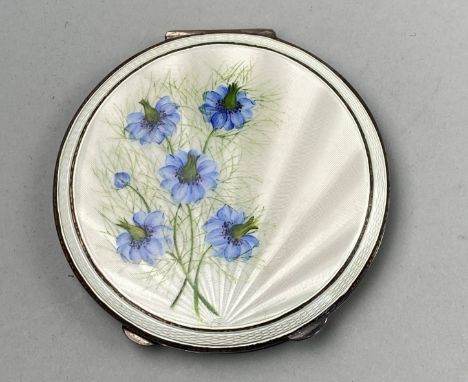 SILVER AND ENAMEL CIRCULAR COMPACT, decorated with blue flowers