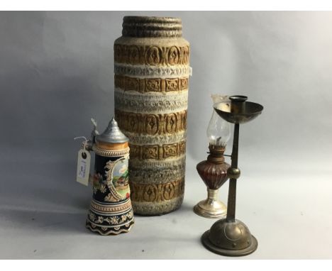 WEST GERMAN POTTERY VASE, 41cm high, along with a small oil lamp, brass candlestick and a musical tankard (4)