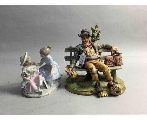 CAPO DI MONTE FIGURE OF A MAN ON A BENCH, 25cm wide, along with a Nao figure group (2)