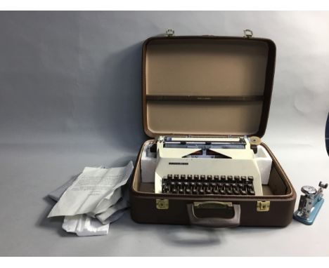VINTAGE TYPEWRITER, in leather carry case, along with a vintage stapler (2)
