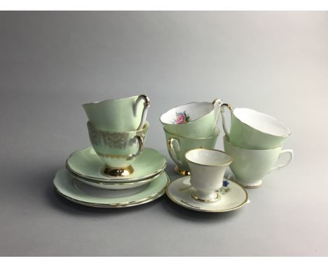 QUEEN ANNE BONE CHINA PART TEA SERVICE, comprising 10 cups, six saucers and 6 side plates, decorated with scrolling foliate g