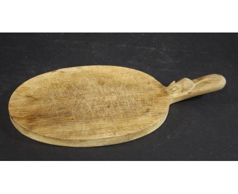 ROBERT THOMPSON OF KILBURN - 'MOUSEMAN' CHEESE BOARD on oval shaped cheese board, made in oak and with a carved Mouse to the 