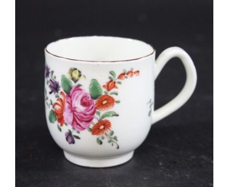 WORCESTER COFFEE CUP painted with European flower sprays and scattered leaves, and with a brown painted rim. 6cms high (a lit