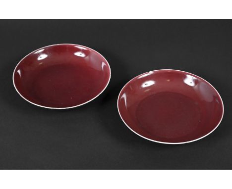 PAIR OF CHINESE IMPERIAL SANG DE BOEUF DISHES - QIANLONG a pair of Qianlong mark and period (1735-1796) sang de boeuf footed 