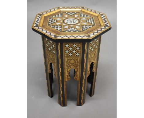 MOORISH OCTAGONAL TABLE an octagonal shaped table, the top inlaid with mother of pearl and various woods in a chevron pattern