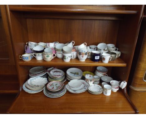 Large quantity of assorted coffee cups and saucers, tea cups etc