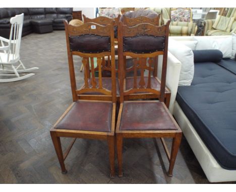 A set of four Edwardian art nouveau light oak dining chairs (some shaky)