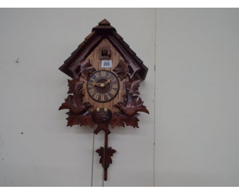 Black Forest style bird decorated cuckoo clock - working