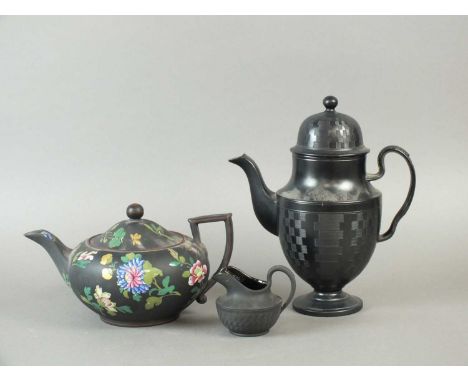 A late 18th-century black basalt coffee pot and cover with engine-turned decoration, 24.5cm high; a similar cream jug, 7.5cm 