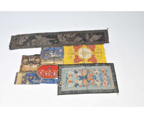 A collection of Chinese textiles to include an early 20th century panel of rectangular form detailing a steamboat and steam t