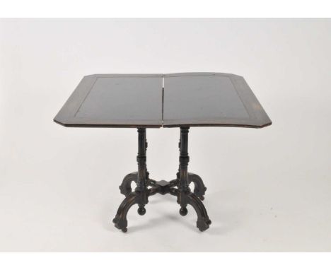 A Victorian Aesthetic movement card table, the rectangular canted fold-over top enclosing a later lined interior an raised on