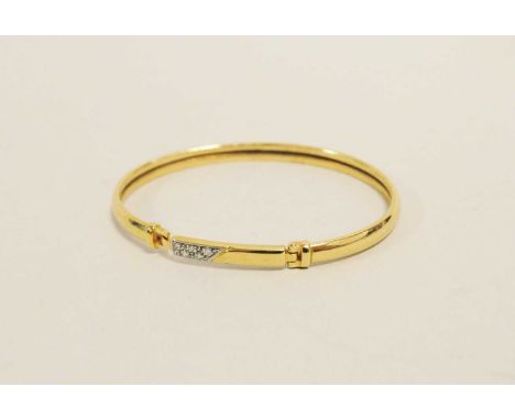 A 9ct gold diamond set bangle, the clasp set with five brilliant cut diamonds, the bangle hallmarked Birmingham, weight appro